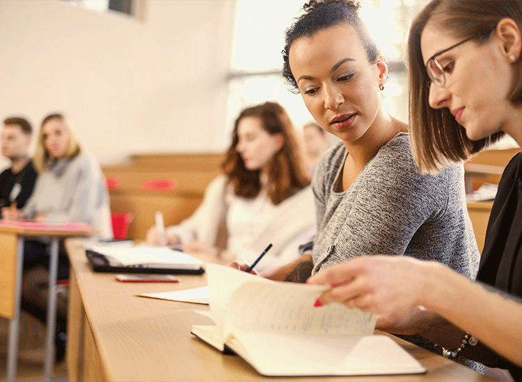Students take a college class during the summer