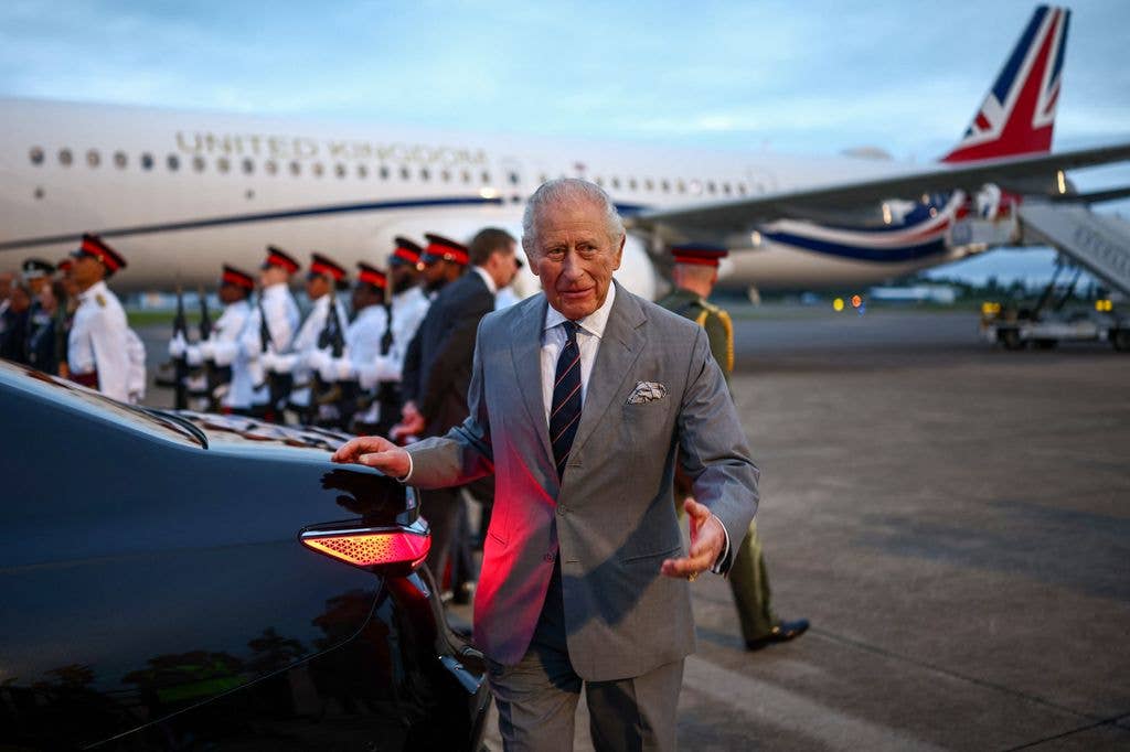 Britain's King Charles III walks toward his vehicle after arriving to the L.F. Wade International Airport in Hamilton, Bermuda, on April 30, 2026. King Charles III is in Bermuda for his first visit to a British Overseas Territory as Sovereign