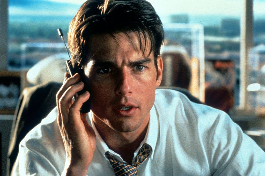 Tom Cruise talks on a phone in a scene from the film 'Jerry Maguire'.