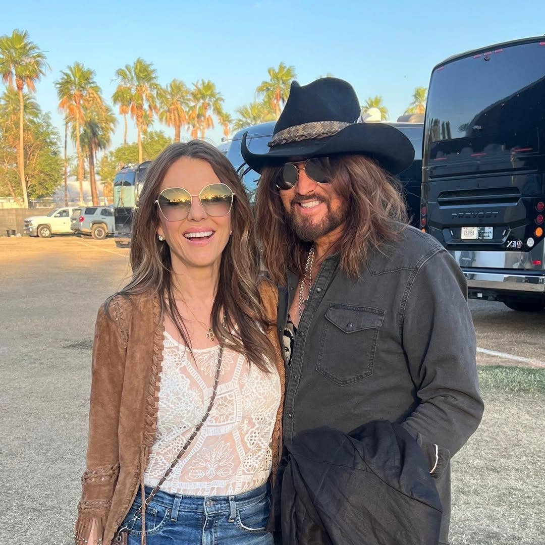Elizabeth Hurley and Billy Ray Cyrus pack on the PDA at country music festival Stagecoach
