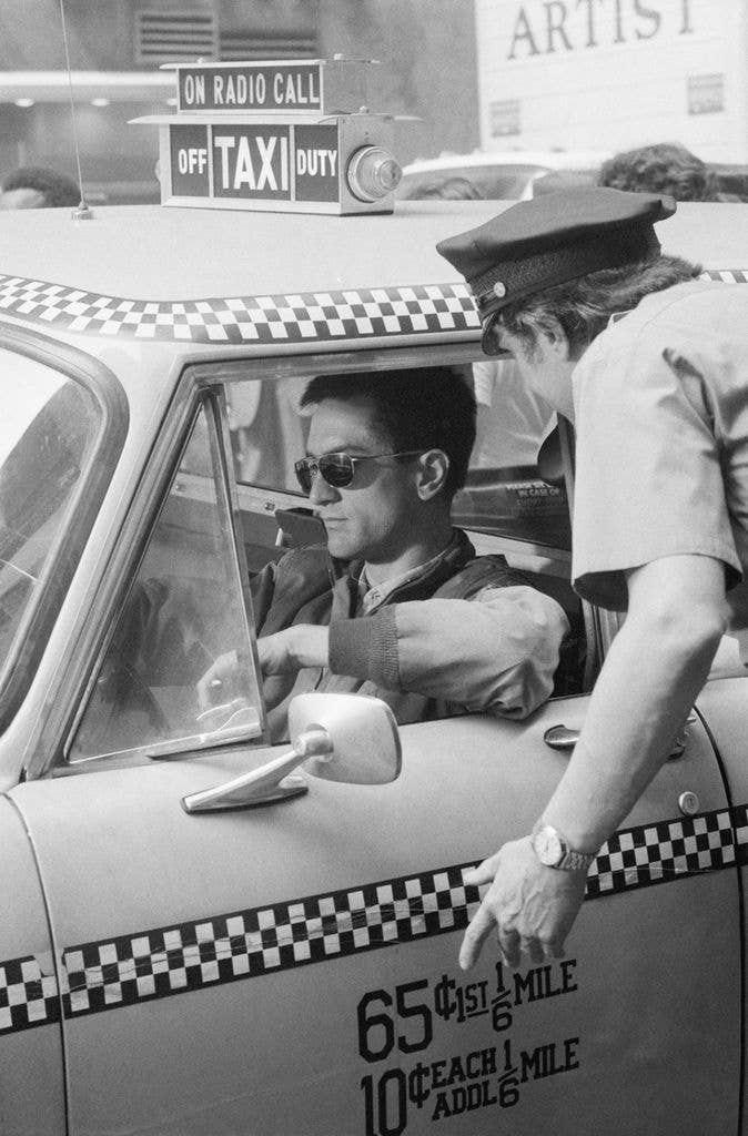 Actor Robert DeNiro is confronted by a policeman in Martin Scorsese's movie Taxi Driver.