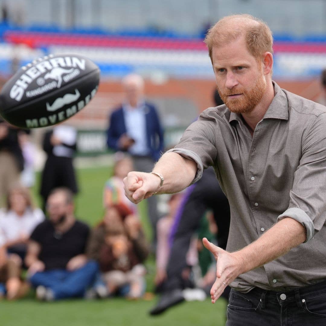 Sporty Prince Harry enjoys football kickabout as he continues second day of Australian tour without wife Meghan Markle