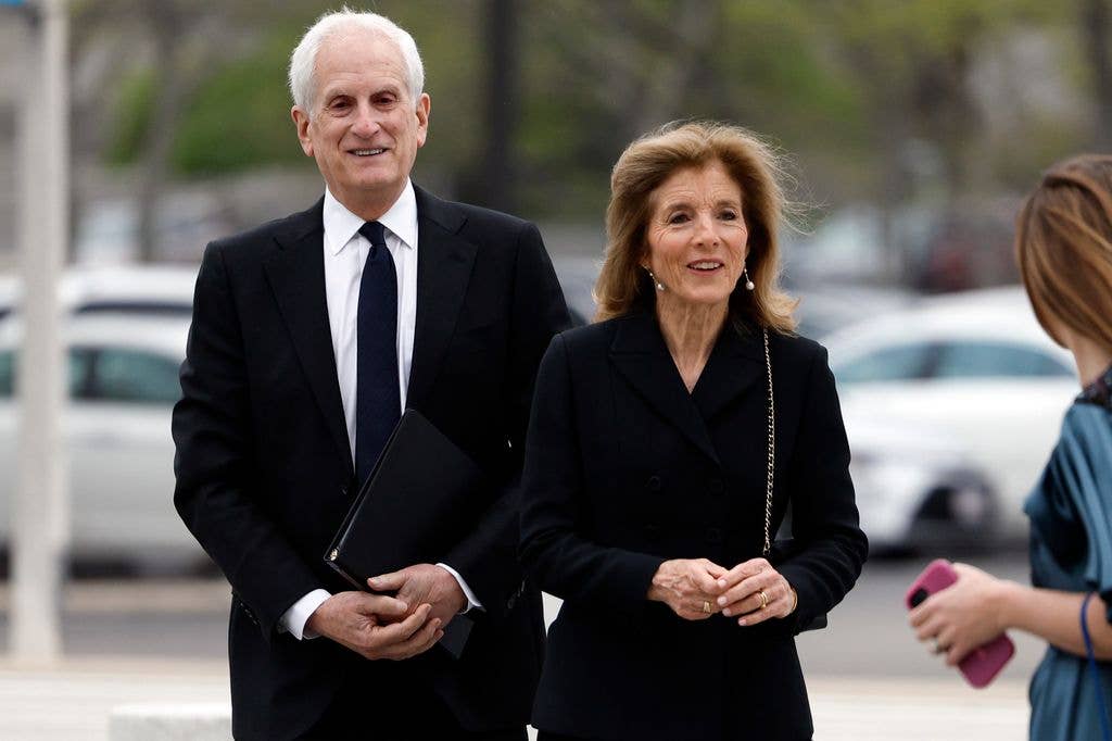 Caroline Kennedy, right, and husband Ed Schlossberg walk into the John F. Kennedy Presidential Library ahead of the annual gala on May 4, 2025.