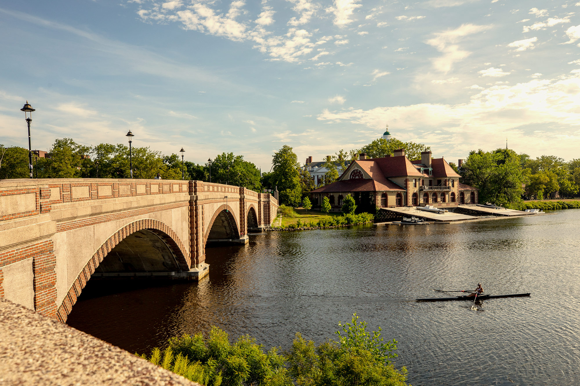 Charles River bridge and Harvard boathouse in Cambridge, MA