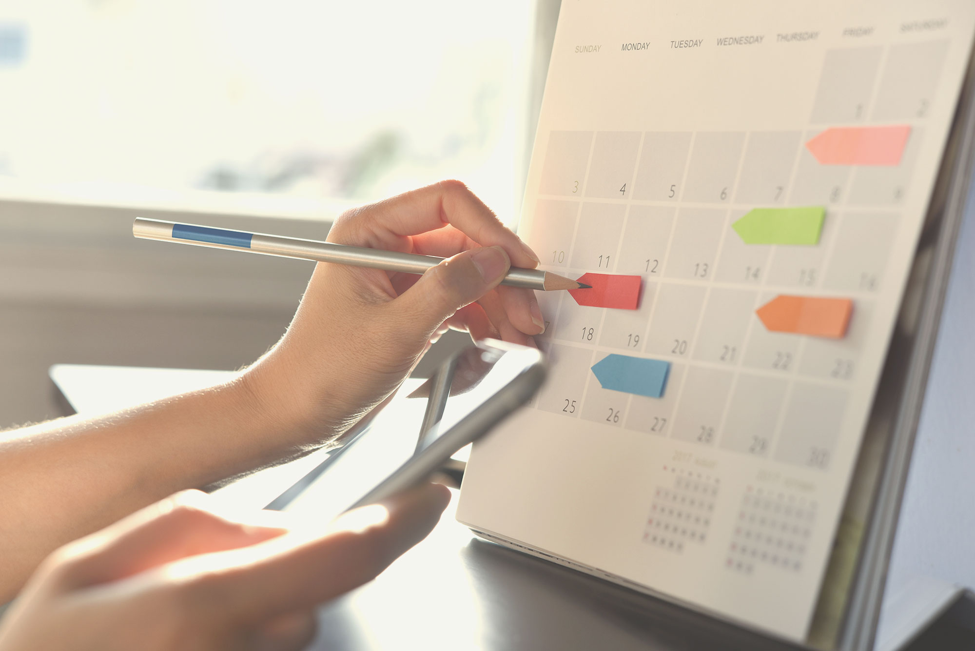 Person setting up a calendar.