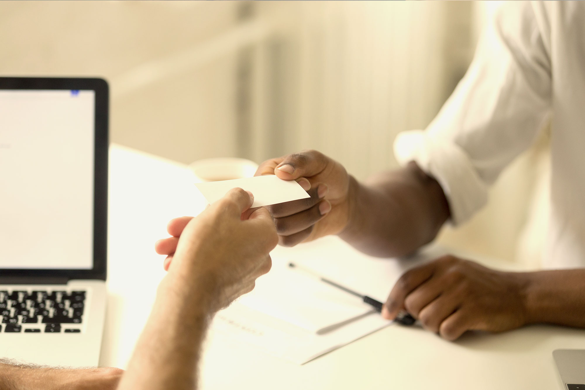 People trading business cards.
