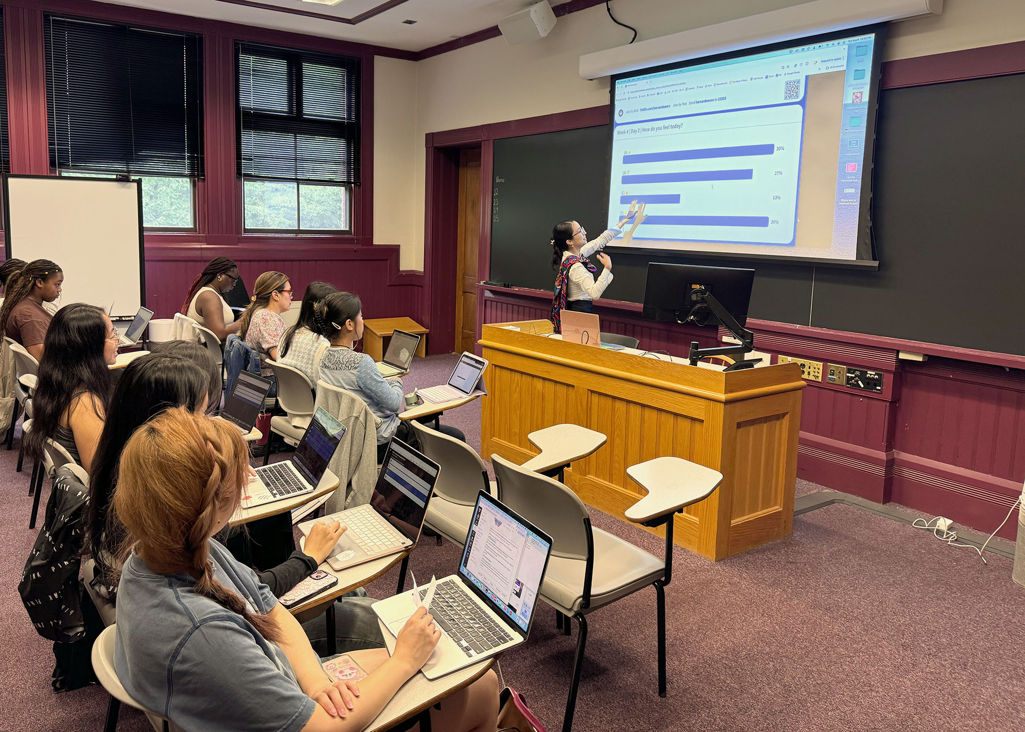 Harvard Summer School students sit in a classroom.