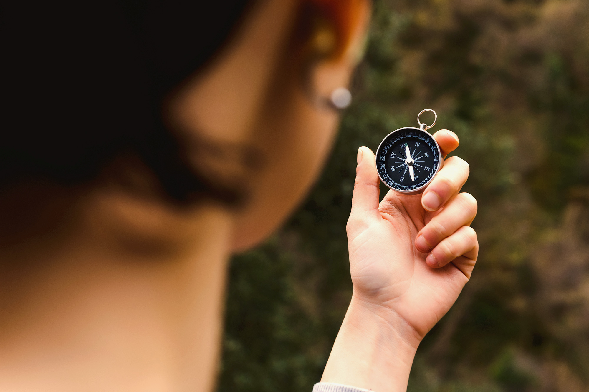 woman holding compass